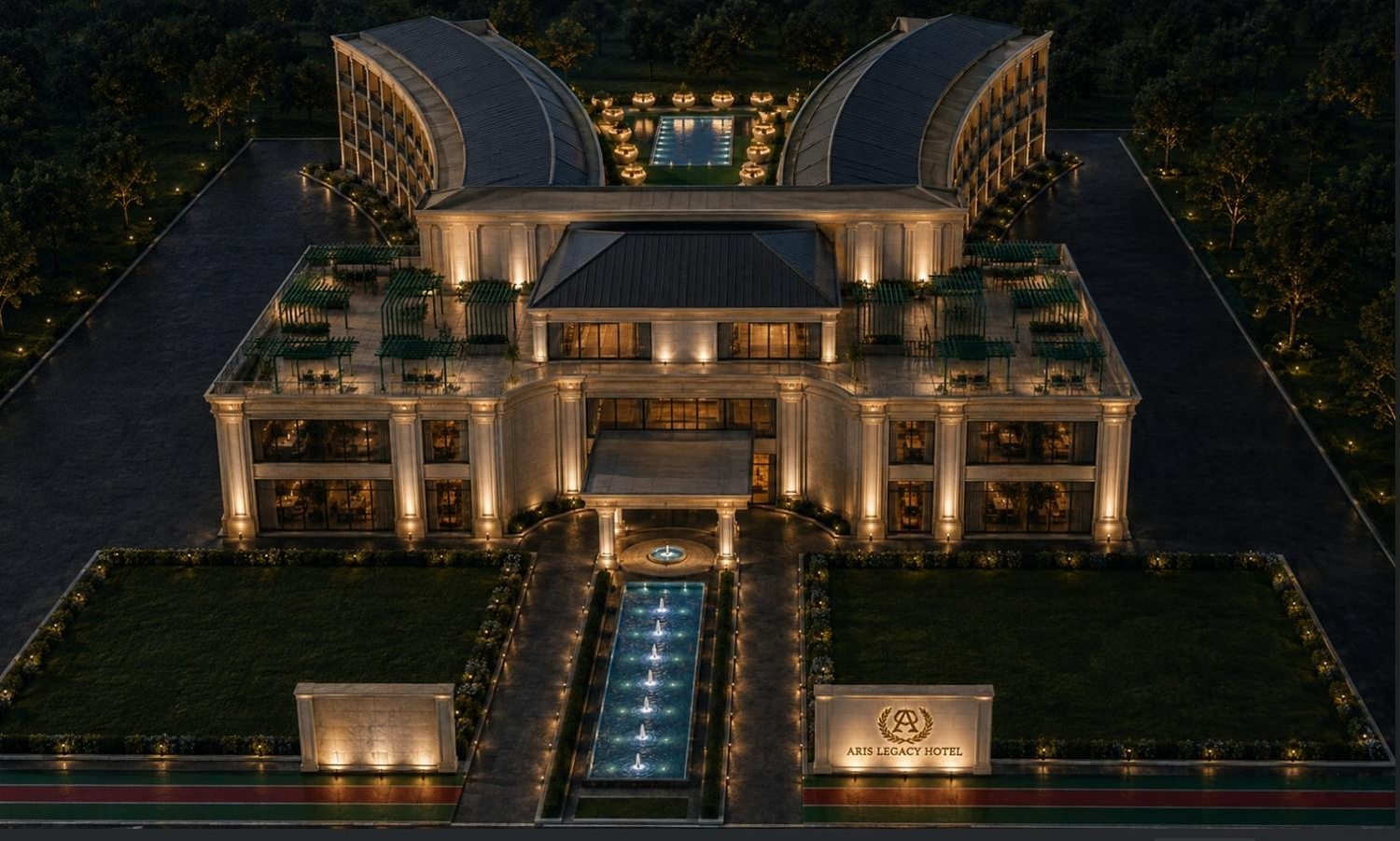 The Aris Legacy Hotel illuminated at night, seen from the forecourt