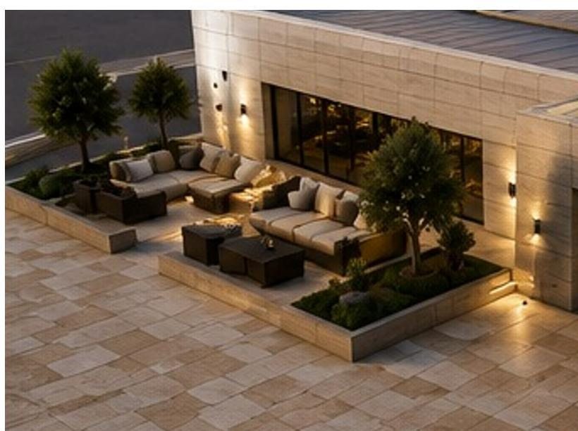 The roof lounge with outdoor seating and planting at dusk
